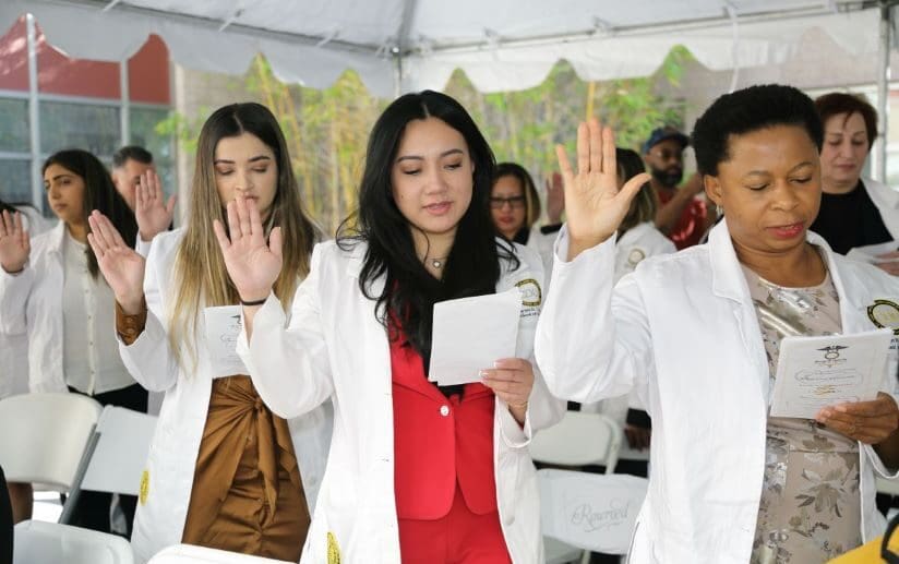 Students recite their oath during College of Nursing's White Coat Ceremony.