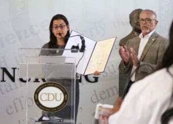 CDU President Dr. David Carlisle stands with Congresswoman Nanette Barragán during the bill presentation.