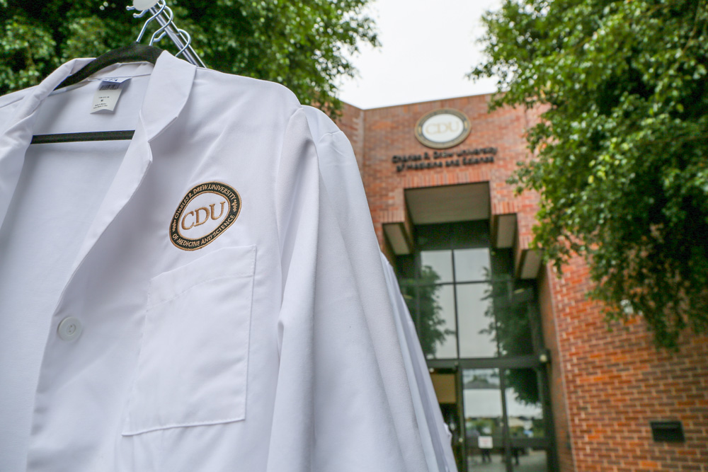 White coat in front of Cobb building