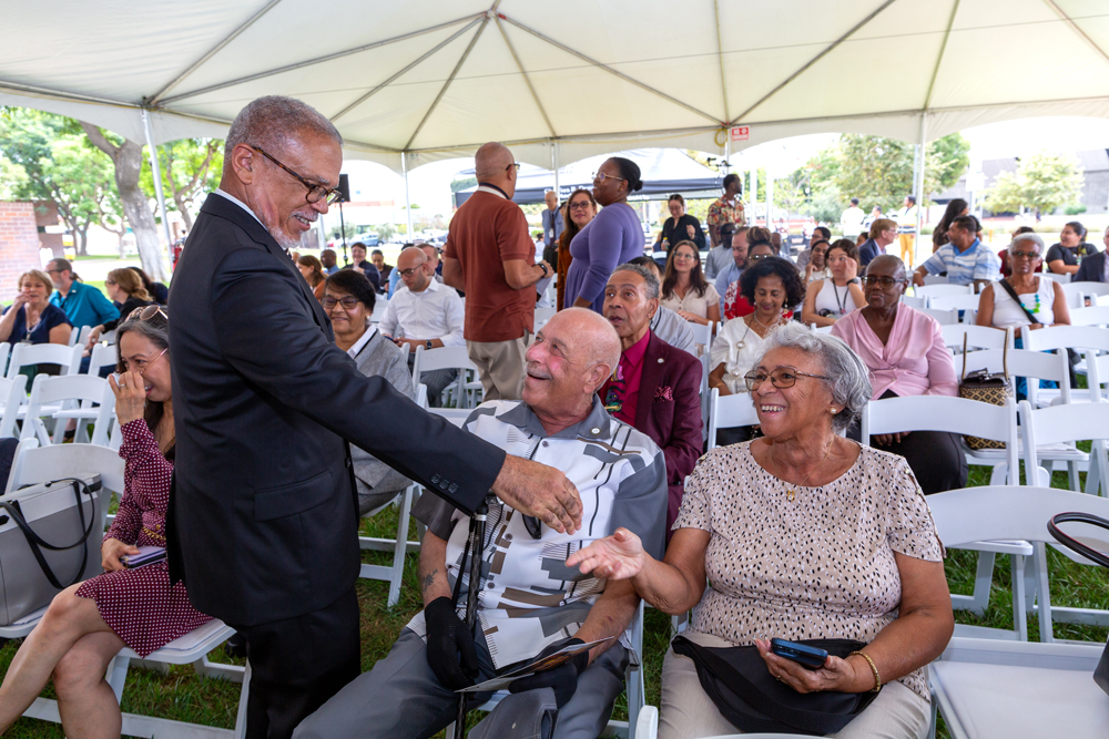 President Carlisle greeting alumni