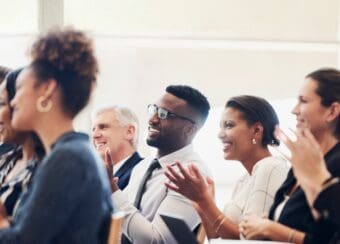 men and women clapping