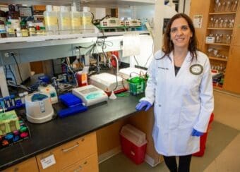Susanna Cavallero standing in research lab