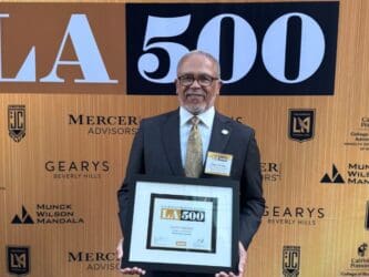 Dr. Carlisle holding LA500 plaque
