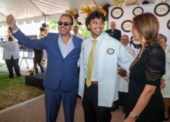 MD student smiling with white coat