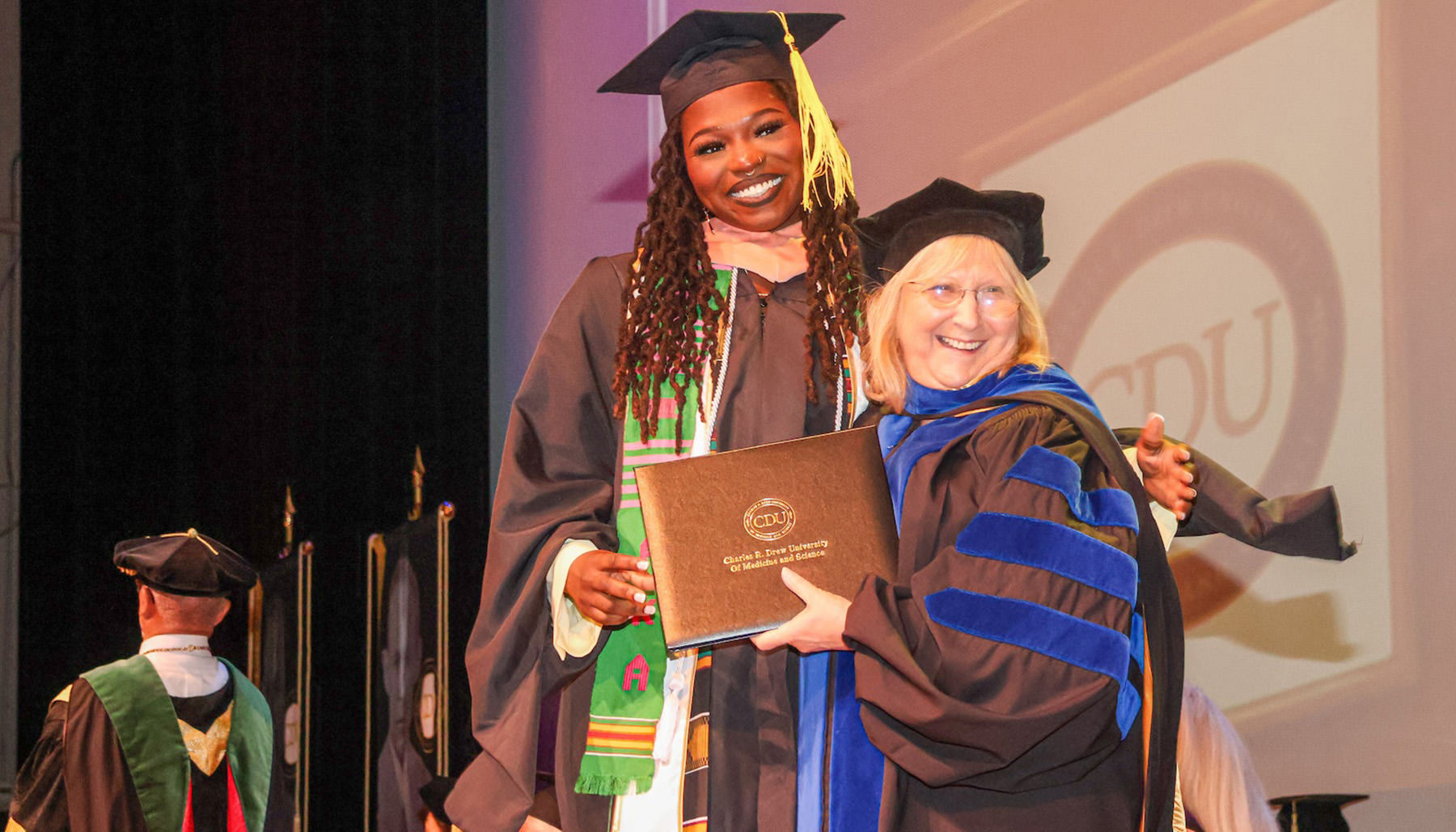 CDU graduate receiving diploma